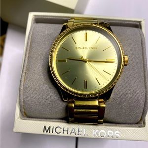Women’s gold Michael Kors watch